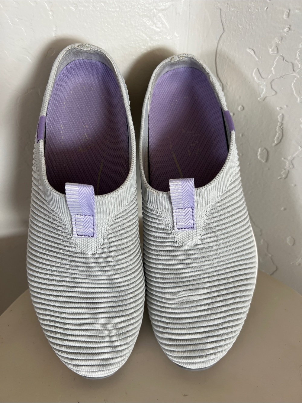 RYKA Light Gray Slip-On Women's Sneakers with Lavender Accents.